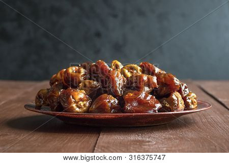 Delicious Organic Sweet Dates In Bowl With Syrup. Iftar Dates.