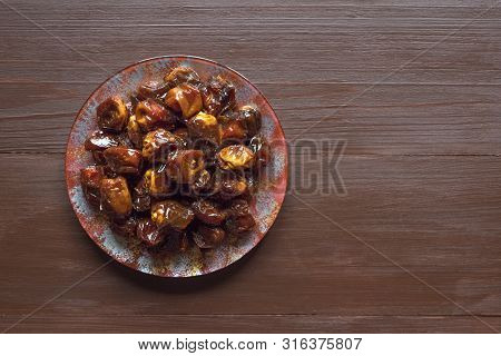Delicious Organic Sweet Dates In Bowl With Syrup. Iftar Dates.