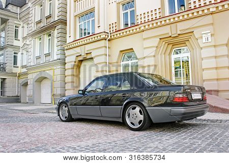 Kiev, Ukraine - September 6, 2013: Mercedes E500 W124 Wolf On The Background Of Beautiful Old Houses