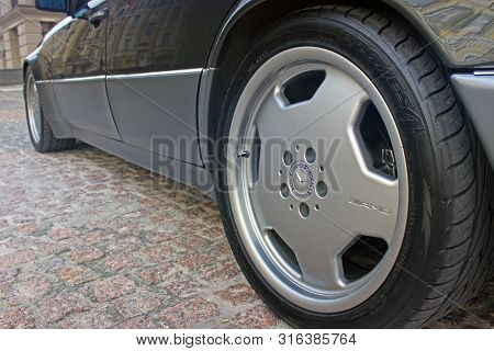 Kiev, Ukraine - September 6, 2013: Mercedes E500 W124 Wolf On The Background Of Beautiful Old Houses