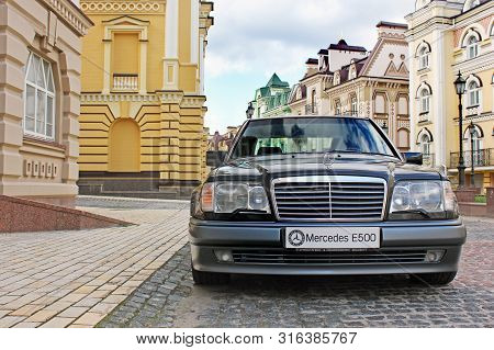 Kiev, Ukraine - September 6, 2013: Mercedes E500 W124 Wolf On The Background Of Beautiful Old Houses