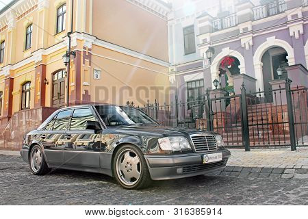 Kiev, Ukraine - September 6, 2013: Mercedes E500 W124 Wolf On The Background Of Beautiful Old Houses