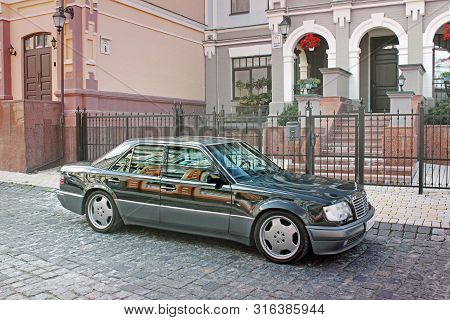 Kiev, Ukraine - September 6, 2013: Mercedes E500 W124 Wolf On The Background Of Beautiful Old Houses