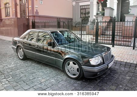 Kiev, Ukraine - September 6, 2013: Mercedes E500 W124 Wolf On The Background Of Beautiful Old Houses