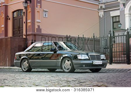 Kiev, Ukraine - September 6, 2013: Mercedes E500 W124 Wolf On The Background Of Beautiful Old Houses