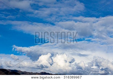Cumulos, Nimbus, Clouds With Angeles Crest Mountains, Blue Sky, Sunlight,