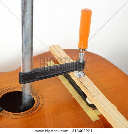Guitar Repair And Service - Glue Fix Acoustic Guitar Bridge
