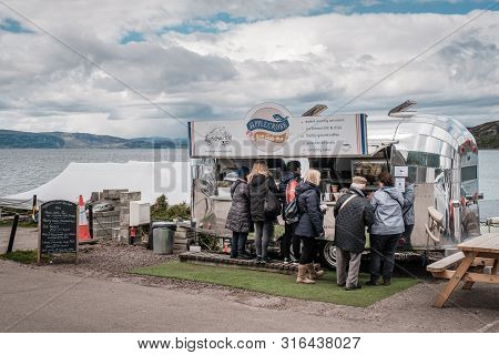 Applecross, Wester Ross Scotland - 8th May 2019. Customers Queue At The Applecross Inn-side Out Take