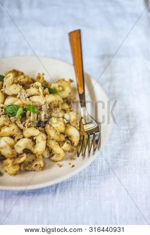 Traditional Soviet Russian Pasta Dish, Vermicelli, Navy Pasta, With Meat On A White Plate On A Light