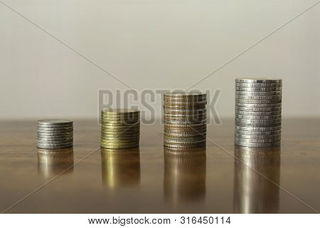Stack The Coins Into Steps. Business Growth Concept