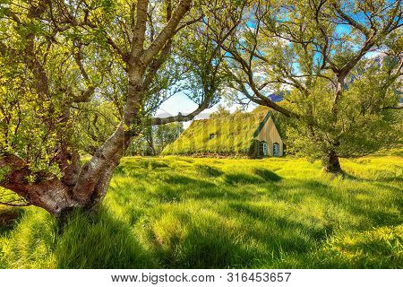Picturesque View Of  Turf-top Church Hofskirkja During Sunset. Location: Village Of Hof, Skaftafell,