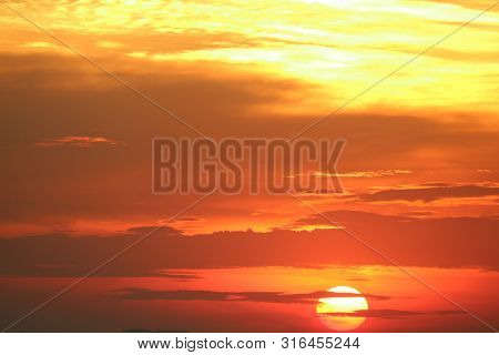 Sunset On Red Orange Sky Back Soft Evening Cloud Over Horizon Sea