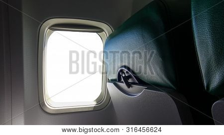 Airplane Window Seat With White Window Inside The Aircraft. Empty Cabin On Airplane Passenger. Trave