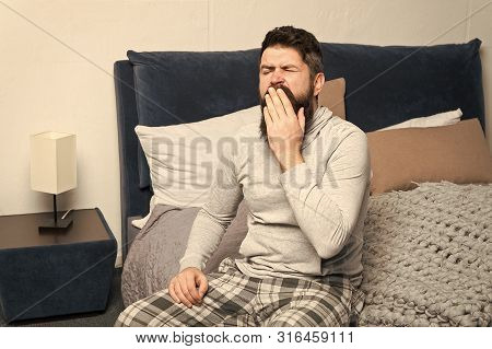 Sweet Yawn. Get Up Early. Tips For Waking Up Early. Man Bearded Hipster Sleepy Face Waking Up Bedroo