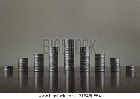 Stack The Coins Into Steps. Business Growth Concept