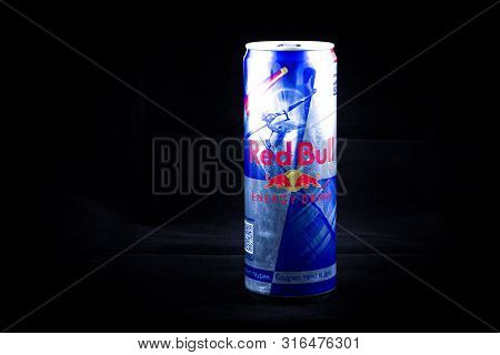 Sankt-petersburg, Russia - August 5, 2019: Aluminum Can Of Redbull Drink Over Dark Background. Red B