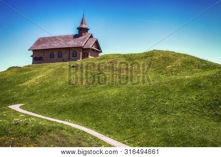 Stoos, Switzerland June 2 2019: A Wooden Church In The Mountains, Stoos, Switzerland.