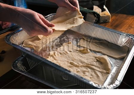 Uncooked Puff Pastry In An Aluminum Tray. Uncooked Puff Pastry In An Aluminum Tray.