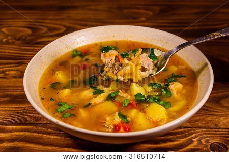 Georgian Traditional Food Soup Kharcho On Rustic Wooden Table
