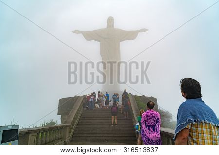 Rio De Janeiro, Brazil - March 2, 1916 : View Of Tourists In Front Of The Christ The Redeemer Statue