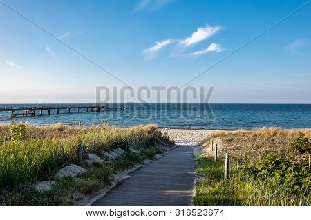 Baltic Sea Coast With Pier In Goehren, Germany.