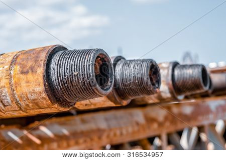 Oil Drill Pipe. Rusty Drill Pipes Were Drilled In The Well Section. Downhole Drilling Rig. Laying Th