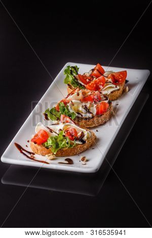 Bruschetta With Tomatoes, Lettuce, Camambert, Balsamic Vinegar