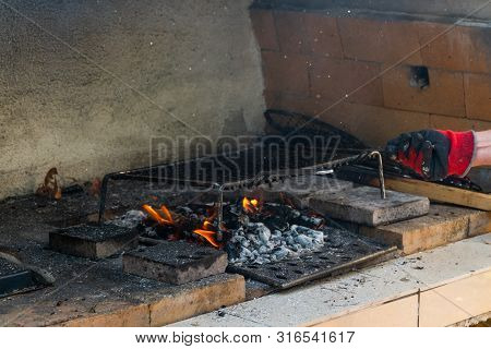 Fire In A Barbaque, Setting Fire On Coal Barbacue