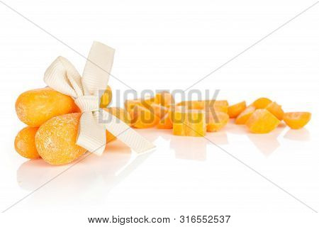 Group Of Three Whole Lot Of Pieces Of Stale  Orange Stale Baby Carrot Baby With Bow Isolated On Whit