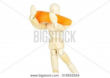 One Whole Stale  Orange Stale Baby Carrot Baby On Wooden Figurine Isolated On White Background