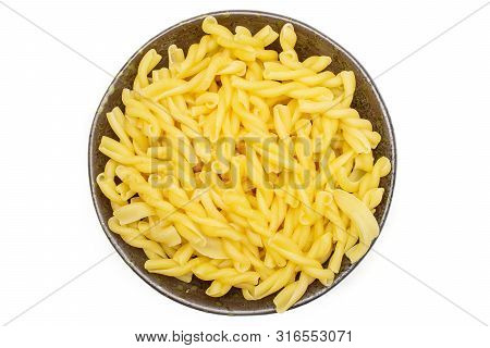 Lot Of Whole Raw Pasta Gemelli On Grey Ceramic Plate Flatlay Isolated On White Background