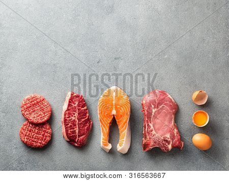 Carnivore Or Keto Diet Concept. Raw Ingredients For Zero Carb Or Low Carb Diet - Burger Patties, Rib