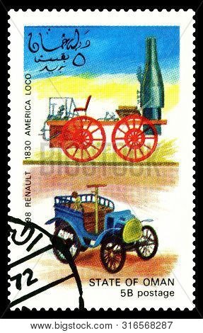 Stavropol, Russia - July 31. 2019: A Stamp Printed In State Of Oman Shows Antique Locomotive America