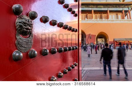 Beijing, China - December 30 2017: Ornate Doorway With Lion In The Forbidden City Looking Towards Sh