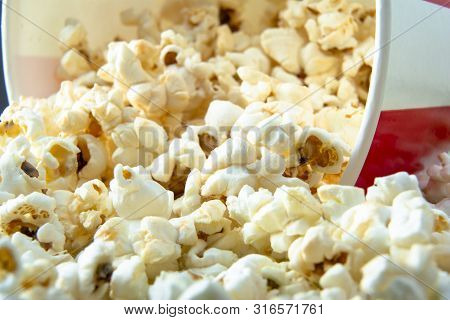 Fresh Crunchy Salted Popcorn On Blue Background. Snack For A Movie, An Idea For A Meal. Close-up, To