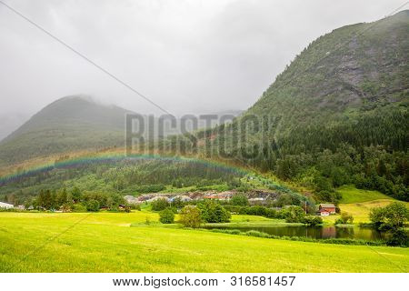 Colorful Rainbow Over The Fields, Lake And Houses Of Skei Village, Jølster In Sogn Og Fjordane Count