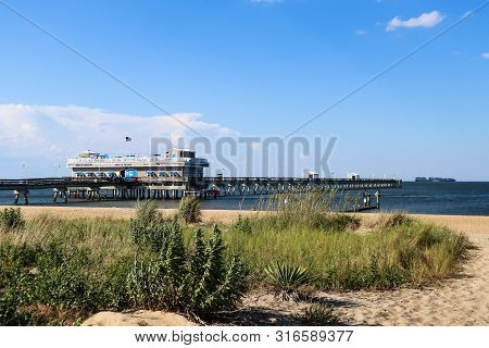 Norfolk, Virginia/usa - July 22, 2019:  Ocean View Fishing Pier, Restaurant And Tackle Shop With Sea