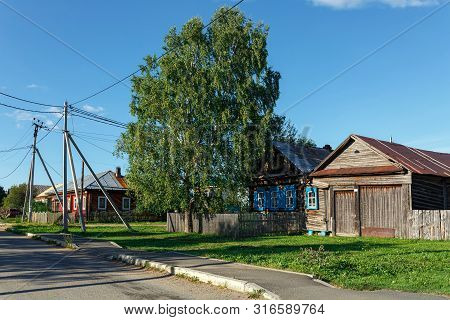 Russian Village In Summer, View Of The Village Street With Traditional Wooden Houses. Village Of Vis