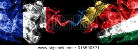 France Vs Seychelles, Seychelloise Smoky Mystic Flags Placed Side By Side. Thick Colored Silky Abstr
