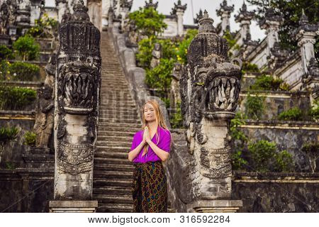 Young Woman Tourist On Background Of Three Stone Ladders In Beautiful Pura Lempuyang Luhur Temple. S