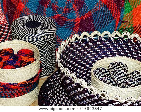 Wicker Baskets, Vases And Placemats Made From Toquilla Straw, Vegetable Fiber, And Painted With Vari
