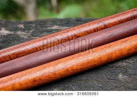 Wood Logs Round Lath Of Burma Padauk, Exotic Wooded Beautiful Pattern For Crafts Or Diy At Blured Ba