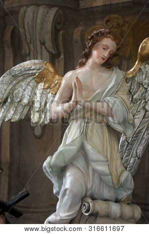 SAMOBOR, CROATIA - MARCH 03, 2018: Angel, statue on the main altar in the Church of the Assumption of the Virgin Mary in Samobor, Croatia