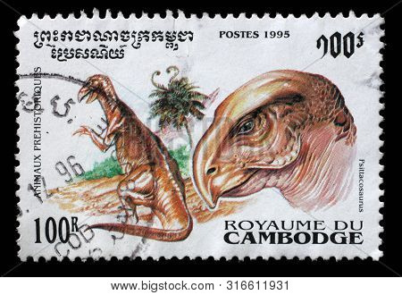 ZAGREB, CROATIA - SEPTEMBER 11, 2014: A stamp issued in Cambodia, shows Psittacosaurus, Prehistoric Animals series, circa 1995.