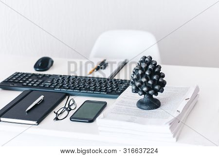 Modern Workplace: White Table And Chair, Keyboard Laptop Computer, Concrete Holder With Pencils And 