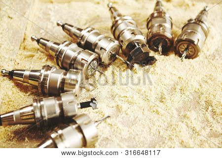 Woodworking Bits For Router Machine On Sawdust.