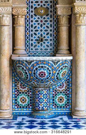 Public Water Basin With Blue Mosaics In Arabian Style Supplying Fresh Water On Hot Days