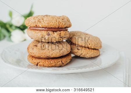Delicious Crumbly Italian Sandwich Cookies Baci Di Dama Or Lady Kisses With Chocolate Filling On Whi