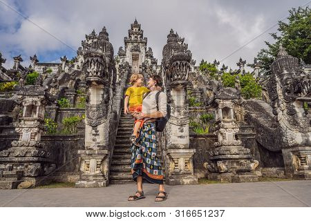 Dad And Son Tourists On Background Of Three Stone Ladders In Beautiful Pura Lempuyang Luhur Temple. 