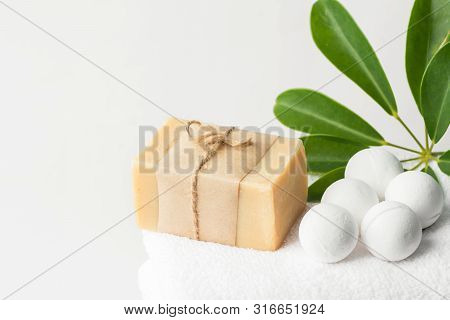 Homemade Vegan Bath Bombs Artisan Olive Oil Soap On White Cotton Terry Towel Green Houseplant In Bat